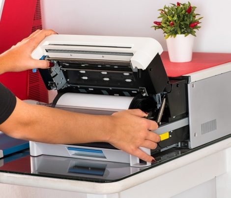 Woman open a sublimation printer in a print shop